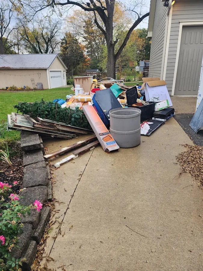 Dumpster being loaded with debris for 10 Yard Dumpster Rental in Paintsville